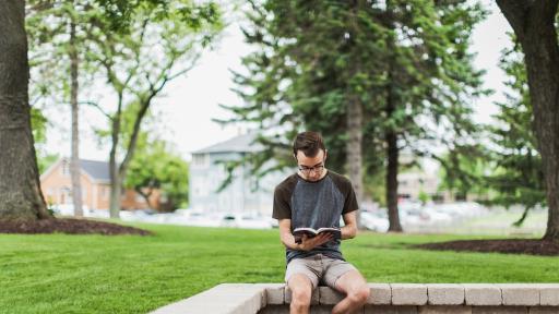 student sitting on campus