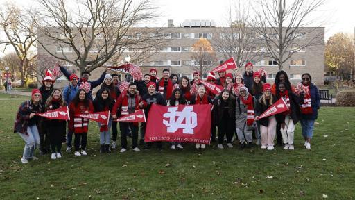 North Central College students holding a banner.